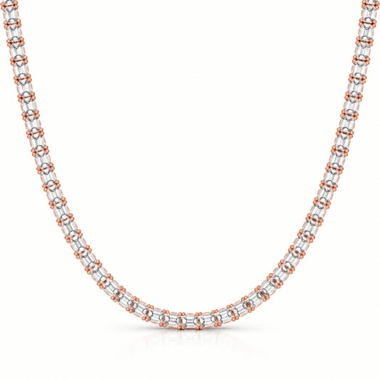 A tennis-style necklace featuring baguette-cut clear gemstones in a silver-toned setting with rose gold accents at the ends of each link, shown against a plain white background.