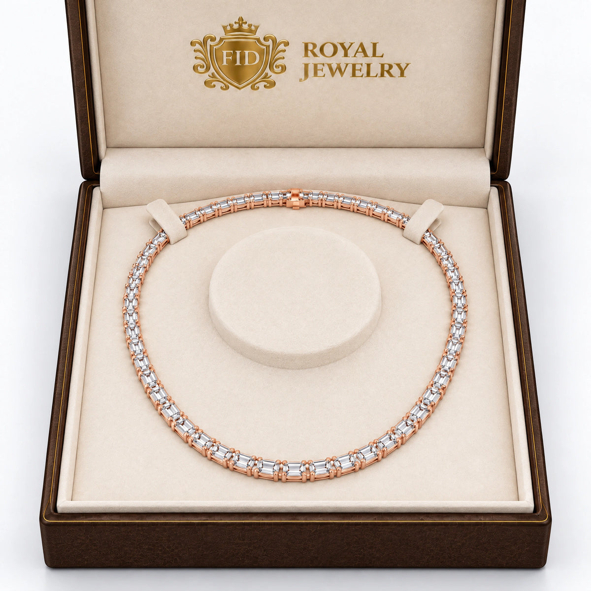 A rose gold tennis necklace with clear gemstones displayed inside an open brown Royal Jewelry gift box on a cream cushion.